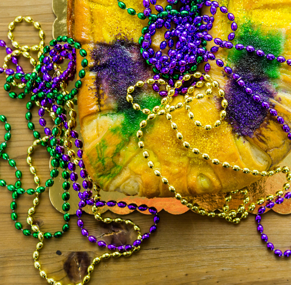 mardi gras beads and king cake