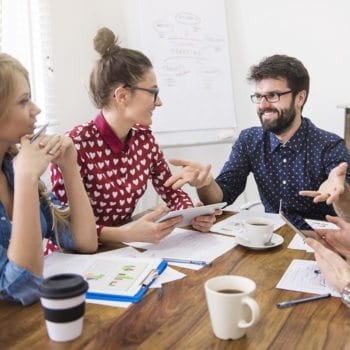 Group of people talking in an office