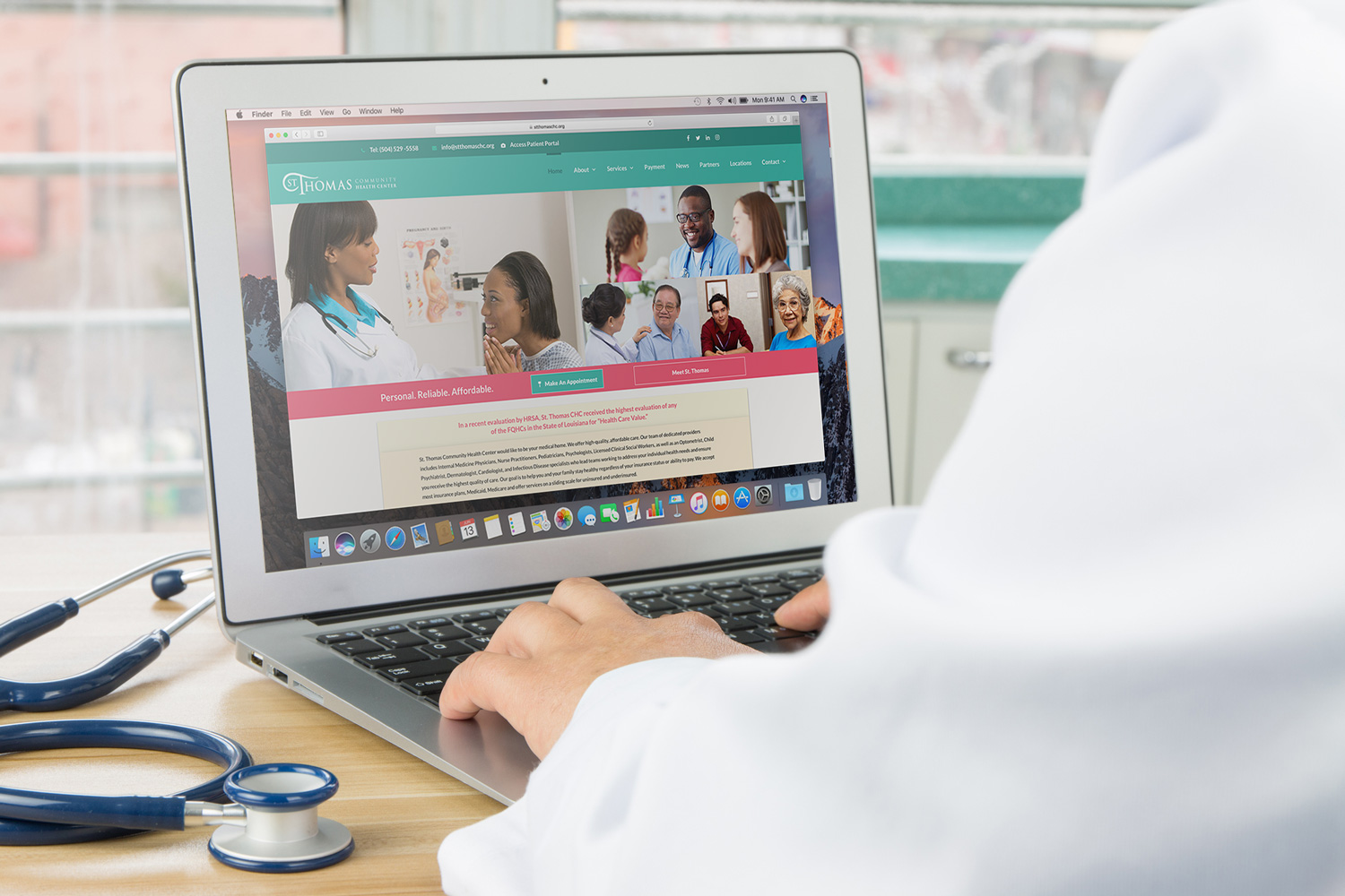 Doctor using St. Thomas' website on a laptop