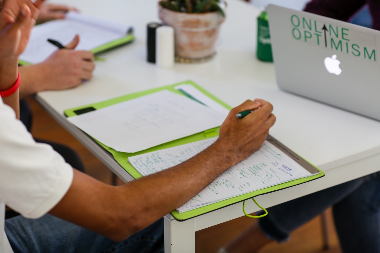 Online Optimism Green Padfolio with Optimistic Laptop and LaCroix