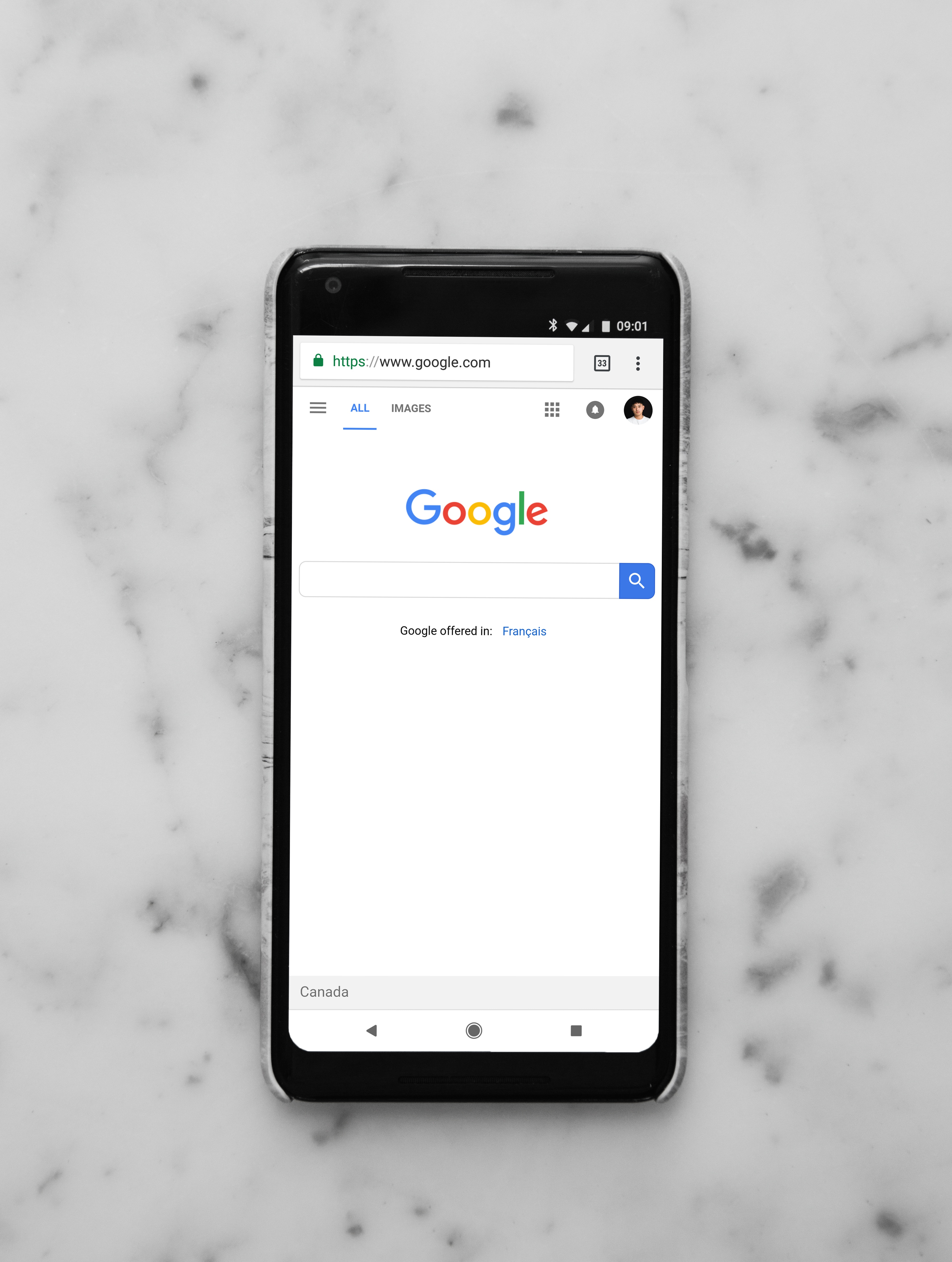 A phone opened to Google.