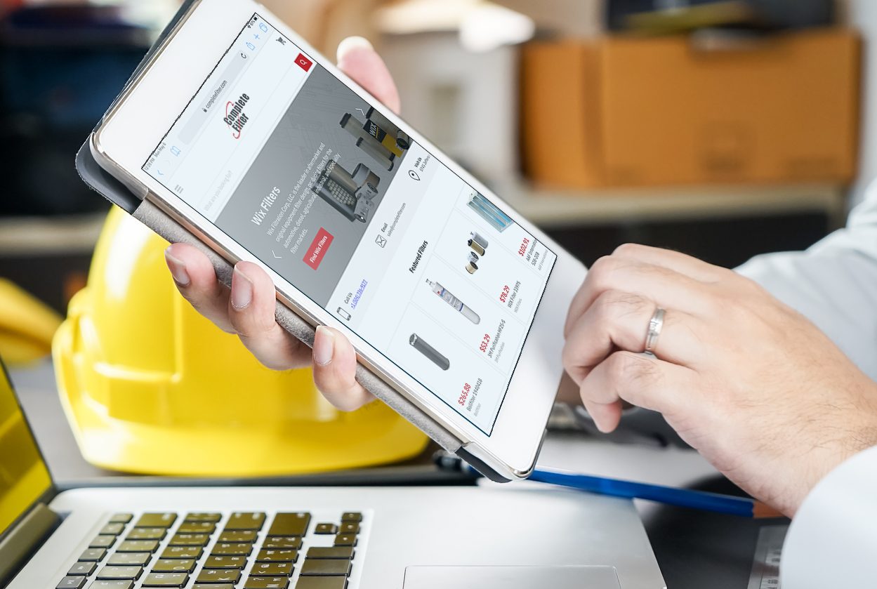 Person uses Complete Filter's new website on a tablet