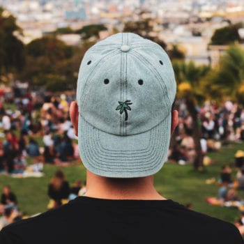 Baseball cap worn backwards on a man's head