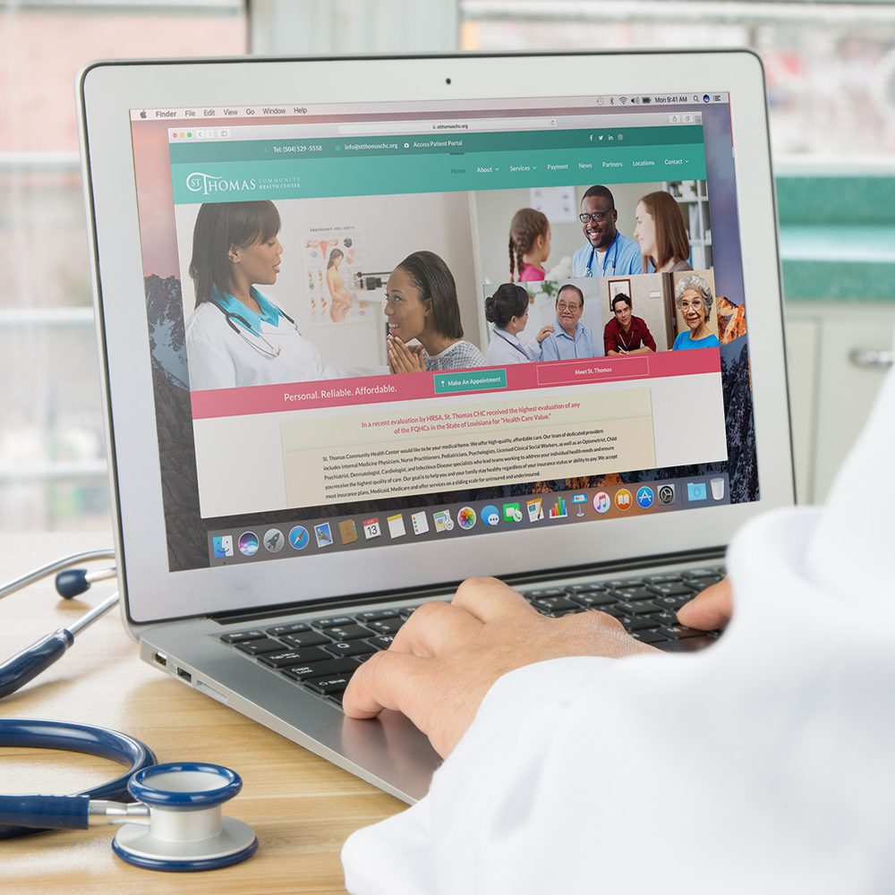 Doctor using St. Thomas' website on a laptop