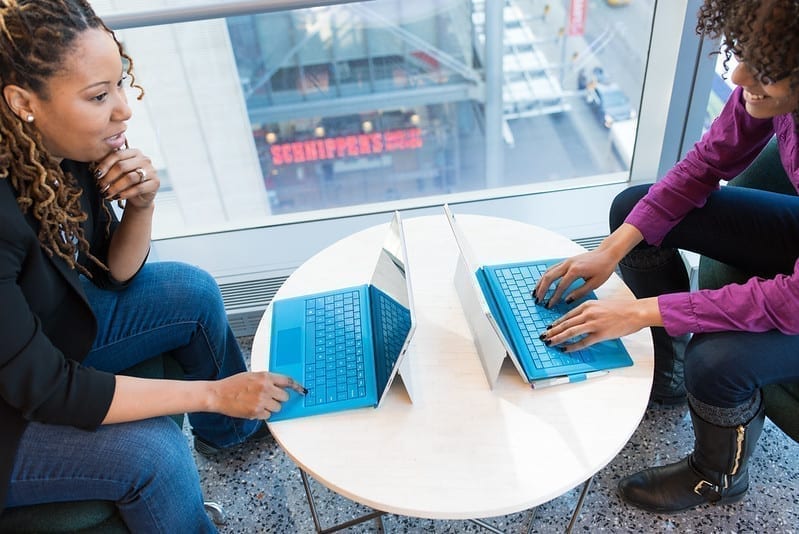 Two women in tech careers. Inclusive stock photos should show people from all walks of life engaged in a variety of normal activities.