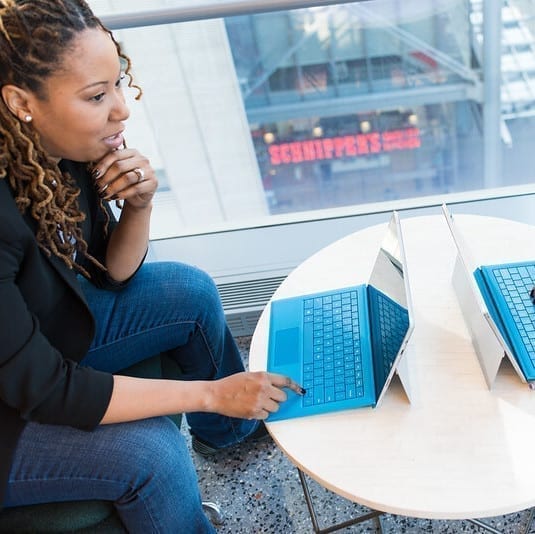 Woman working on a tablet with keyboard