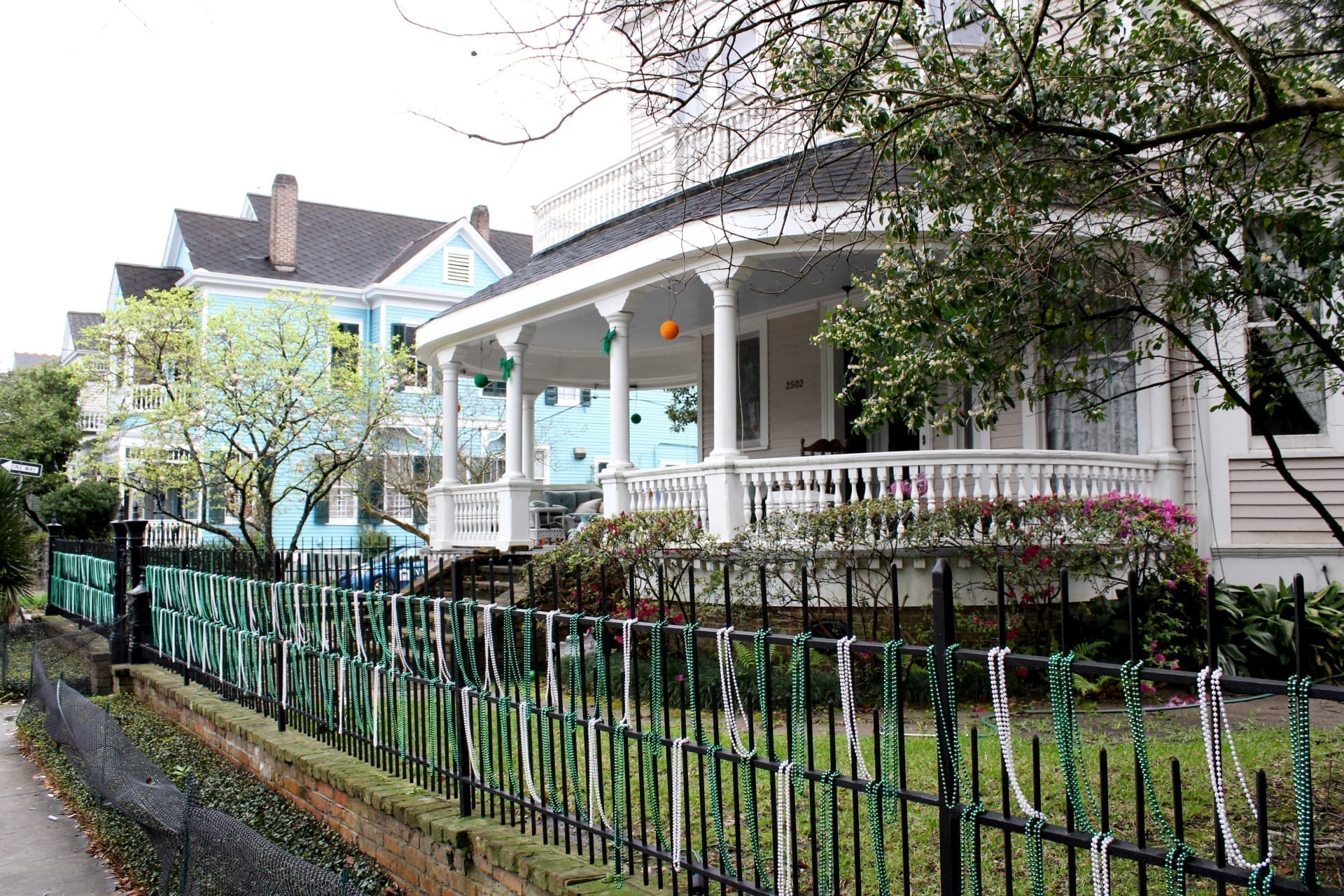 Near the offices of our New Orleans SEO Company, a Louisiana House with Mardi Gras Beads sits in the Garden District