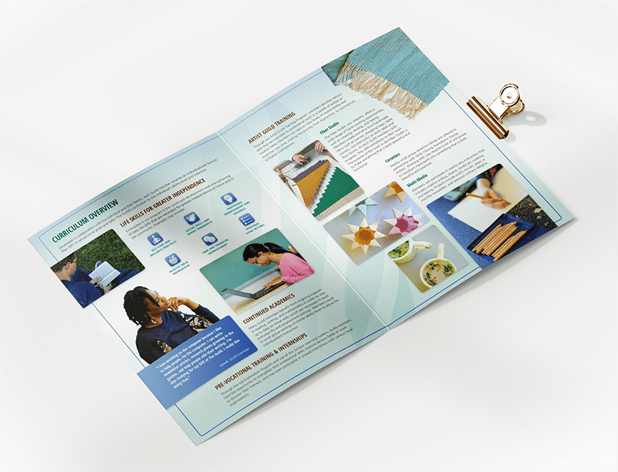 The Guild's packet open to a spread on curriculum and other programs