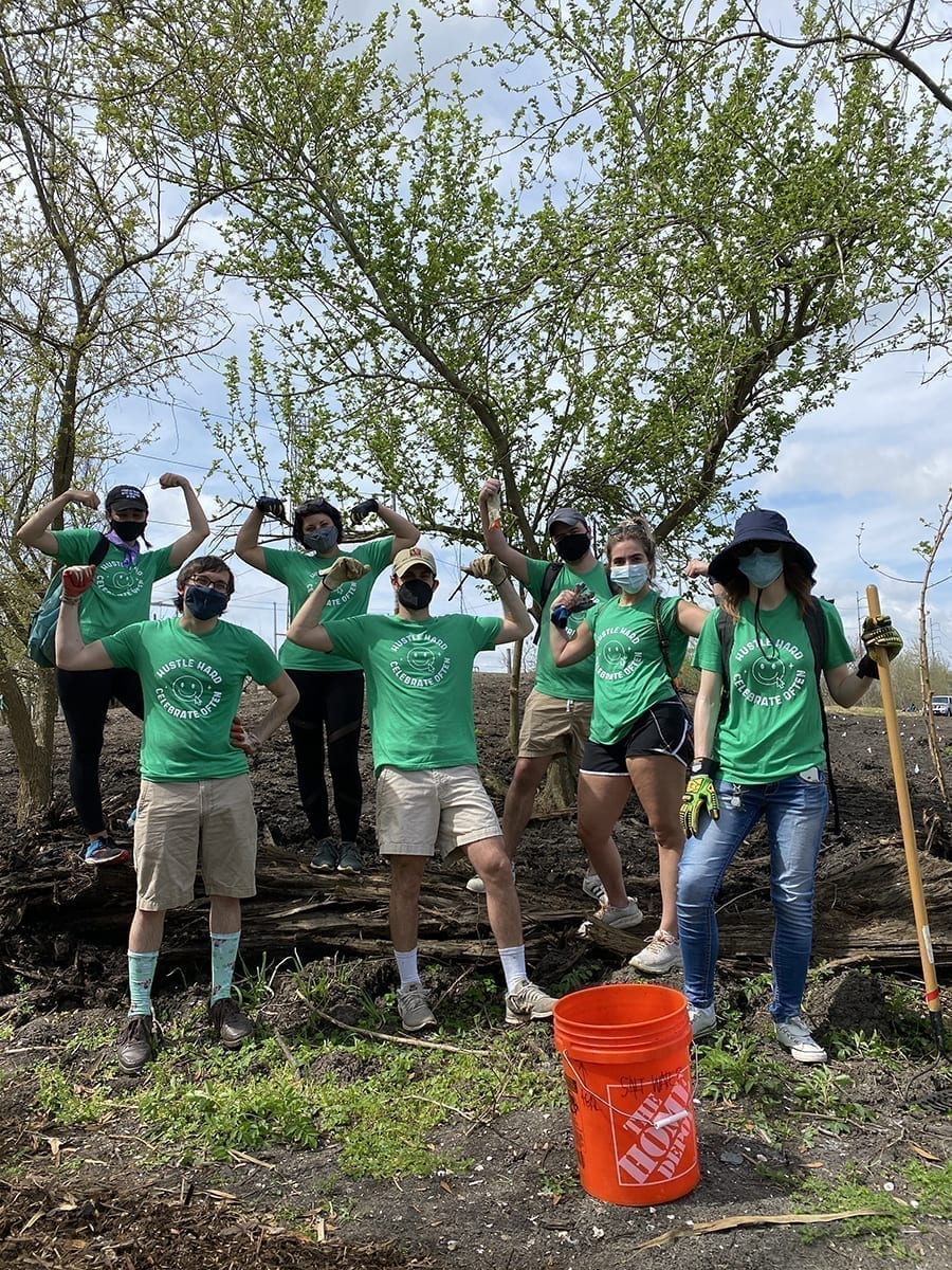 Optimists at a volunteer event with Sankofa