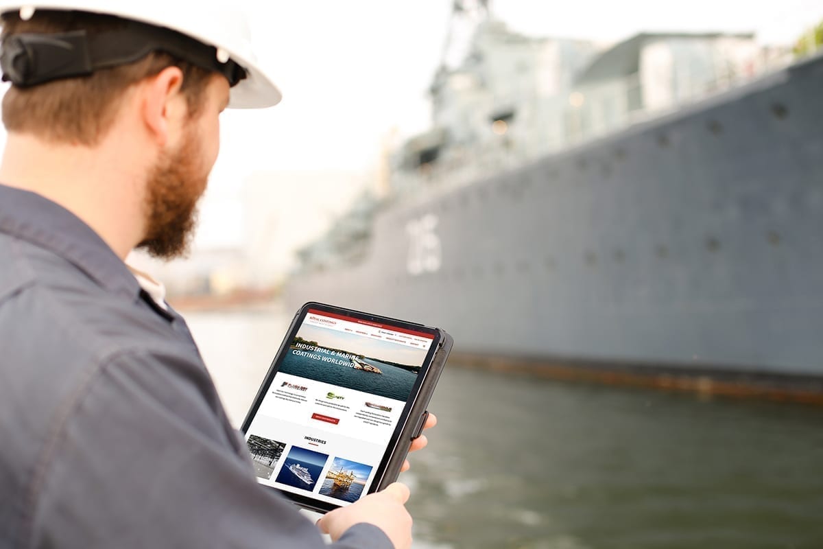 Man uses Royal Coatings' new website at a port