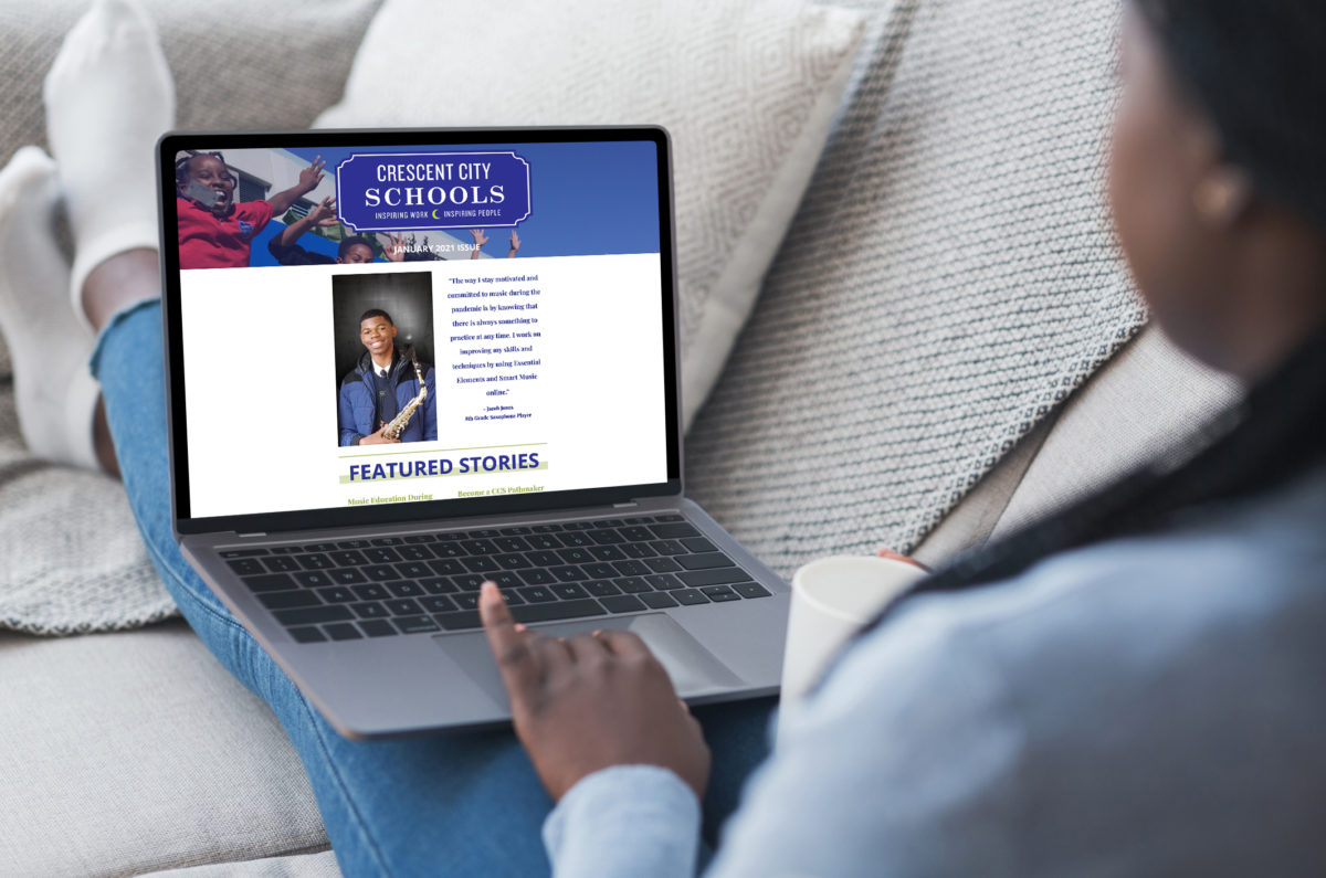 Woman uses laptop to view CCS' newsletter