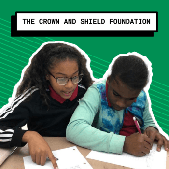 Crown and Shield Foundation with two kids writing
