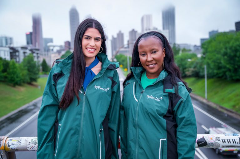 Irene and Ariel in Optimist Rainjackets in Atlanta Landscape