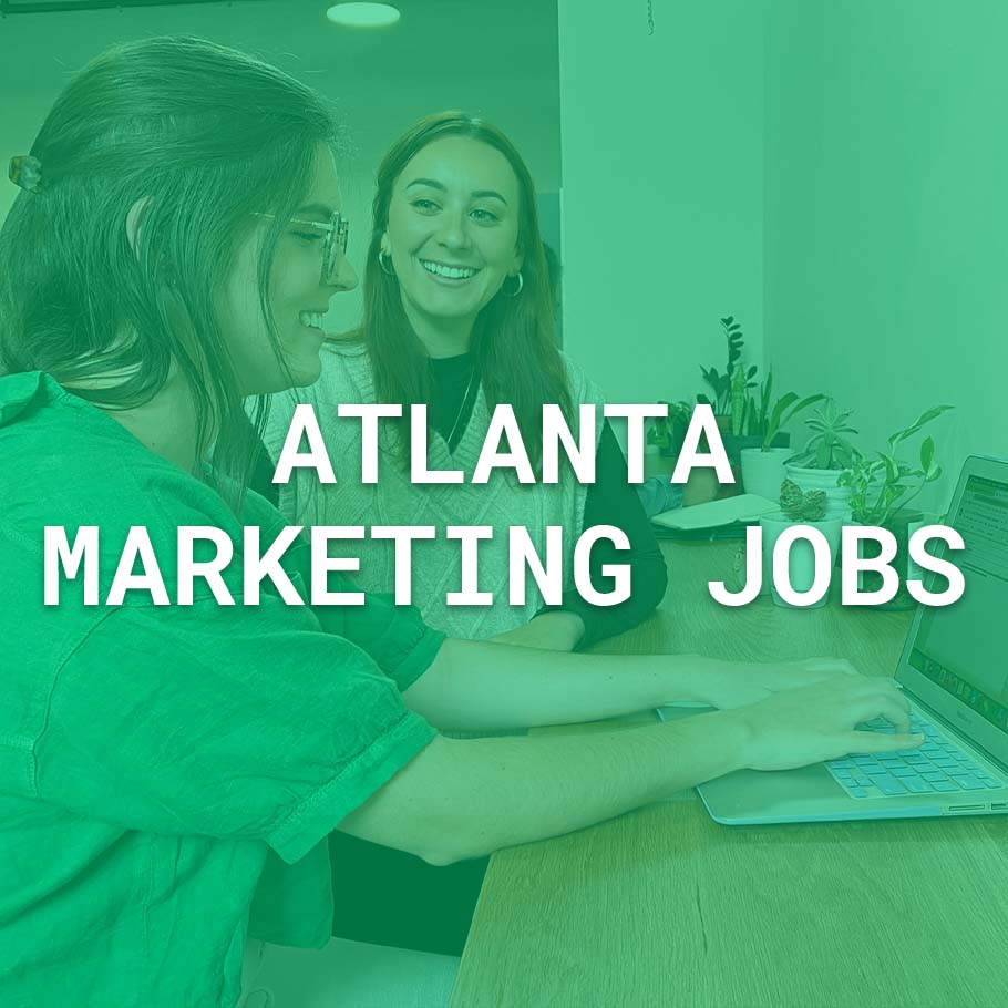 Displays two coworkers smiling at each other. Text overlay says: Atlanta Marketing Jobs.
