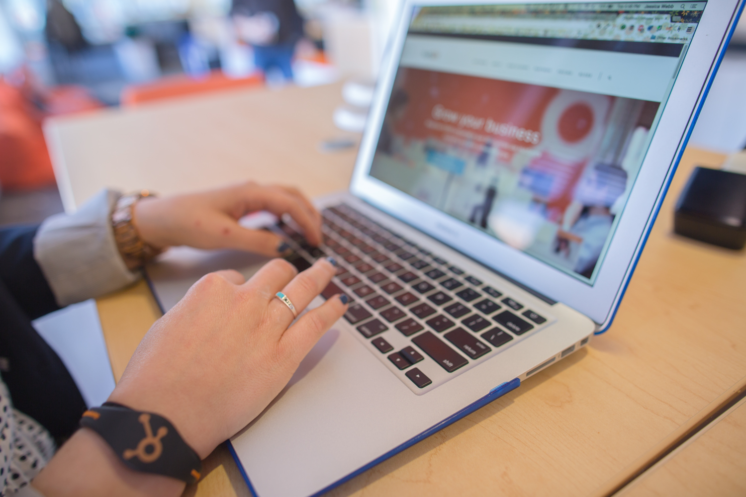 One of the employees at our Bing PPC agency typing on their laptop.