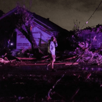 A person standing in the middle of the street after the March 22 tornado in New Orleans