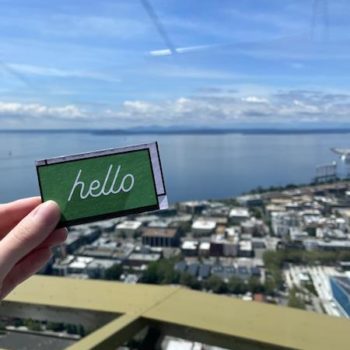 Online Optimism business card over Seattle skyline