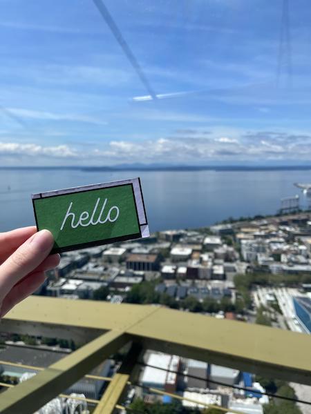 Online Optimism business card over Seattle skyline