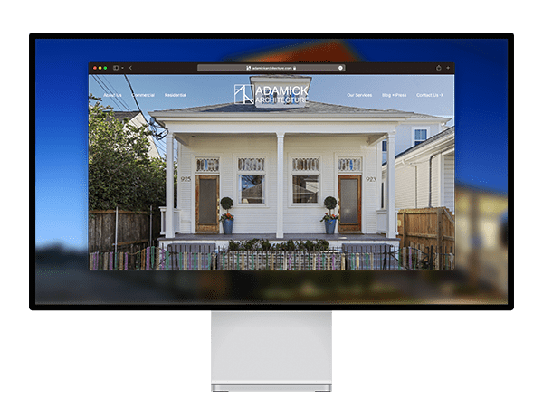 Adamick Architecture homepage on a desktop computer