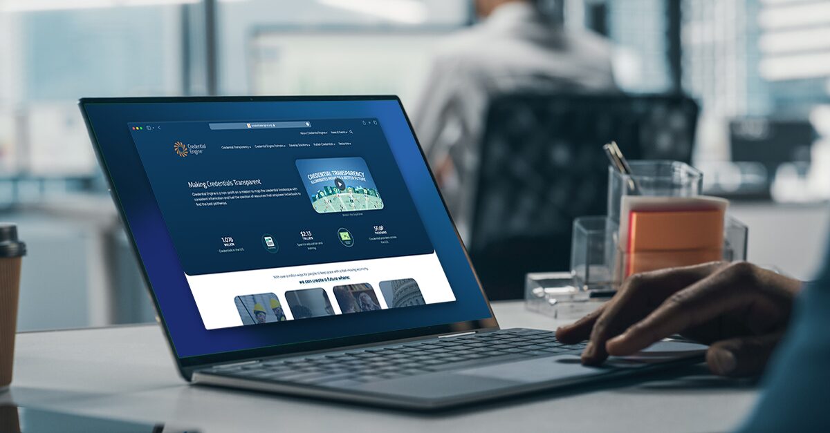A person using Credential Engine's website on a laptop