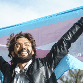 Picture of a Man Smiling with Transgender Flag