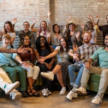 Group photo in the office from Online Optimism's Optimistic team retreat 2024!