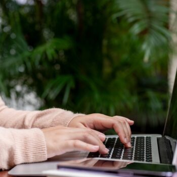 A photo of a person working on a laptop